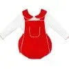 Child-sized bib apron in bright red with large front pocket hanging on white wall