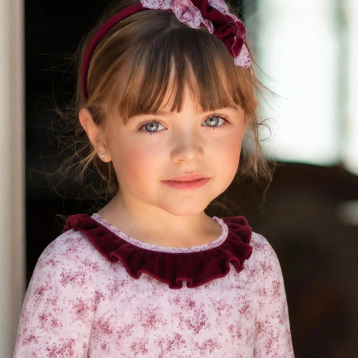 AW26 Miranda Girls Burgundy Floral Headband featuring a layered bow design, perfect for everyday wear. Sizes available: consider going up one size for the perfect fit.