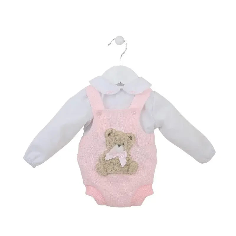 Pink knitted baby romper with teddy bear applique and white long-sleeve shirt on white hanger