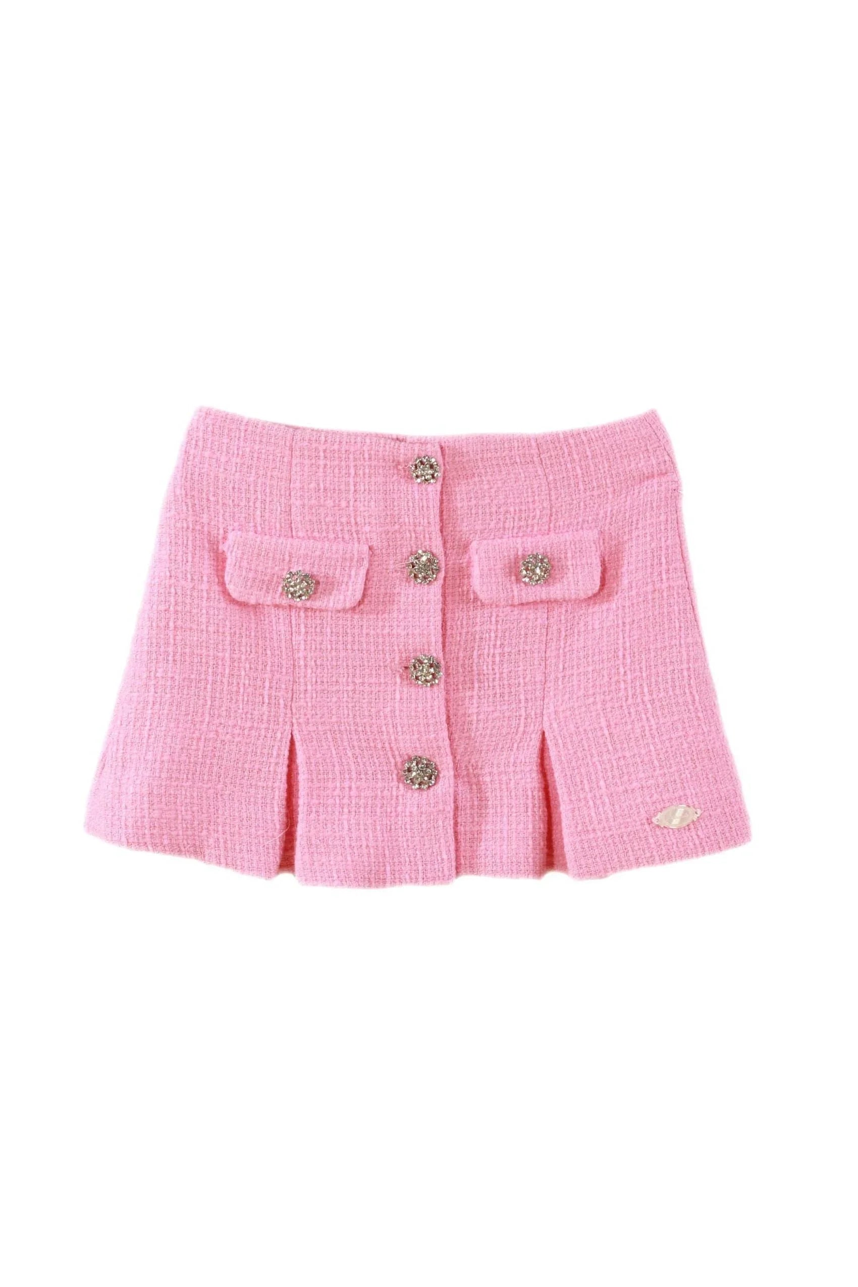 Pink tweed girls skirt with decorative crystal buttons and front pockets on white background
