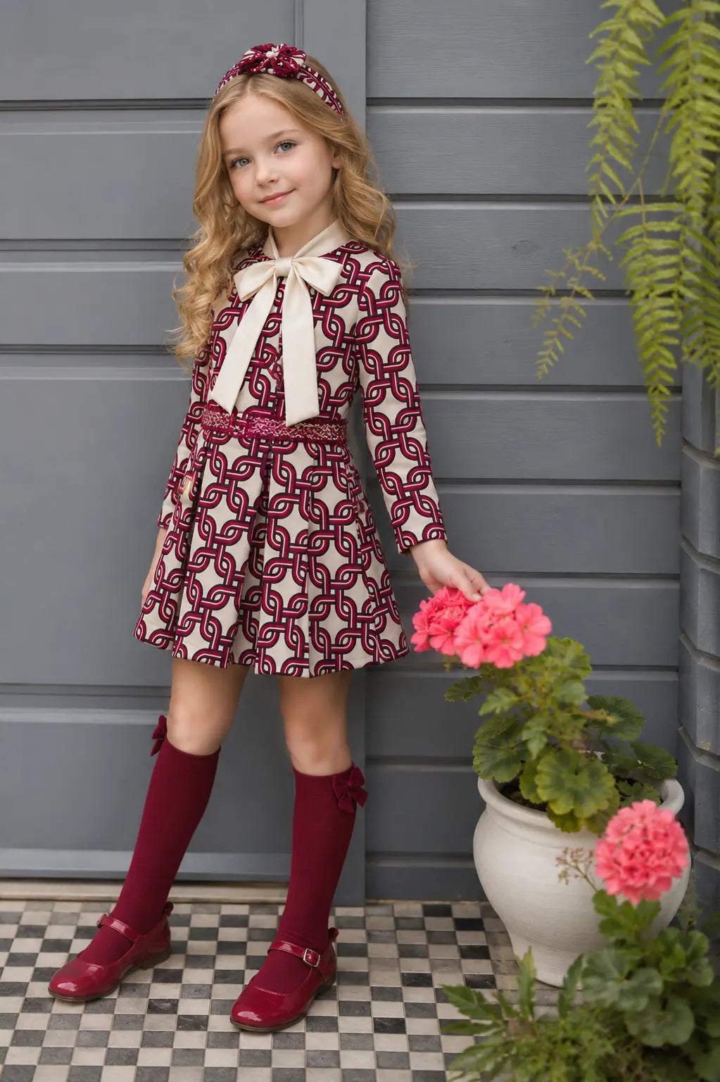 AW26 Rochy girls burgundy cream and navy chain print dress with oversized cream bow and pleated skirt, sizes 4 to 10 years