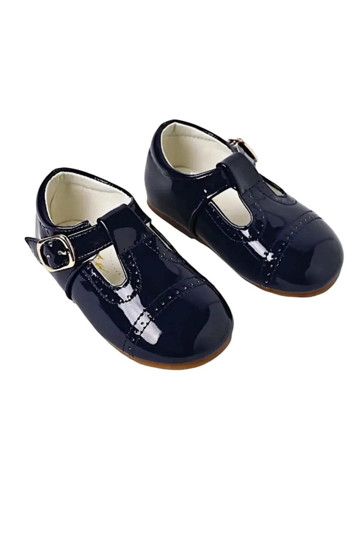 Glossy navy blue baby shoes with T-strap and gold buckle on white background