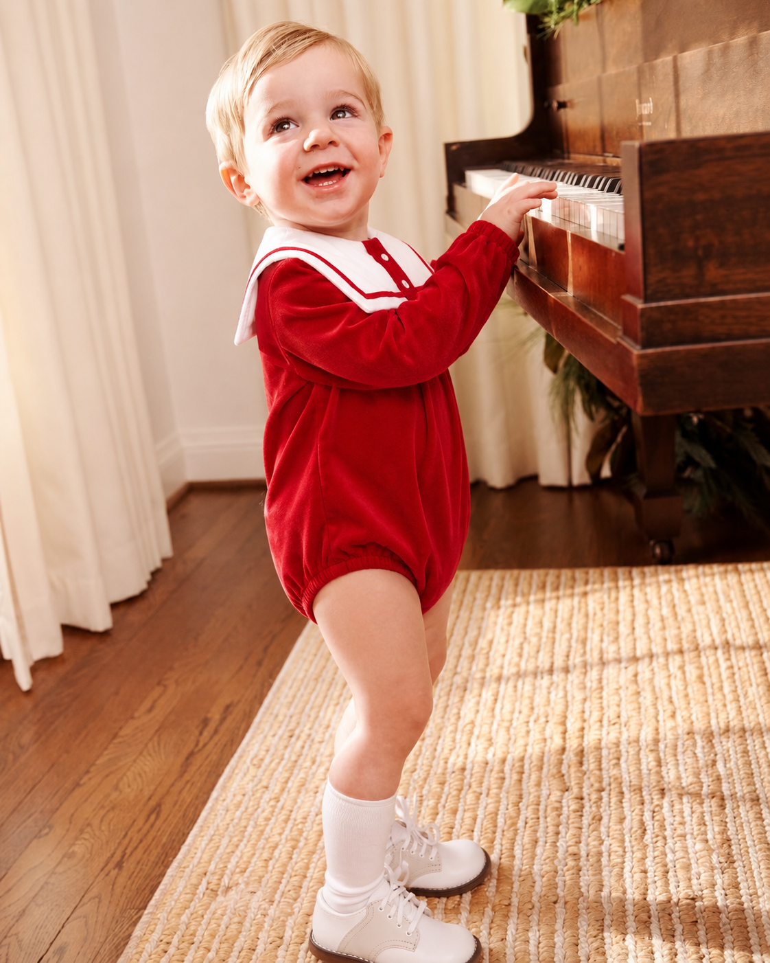 Baby boys’ red velvet sailor collar romper with white collar and red trim – traditional Christmas baby outfit by Dainty Delilah.
