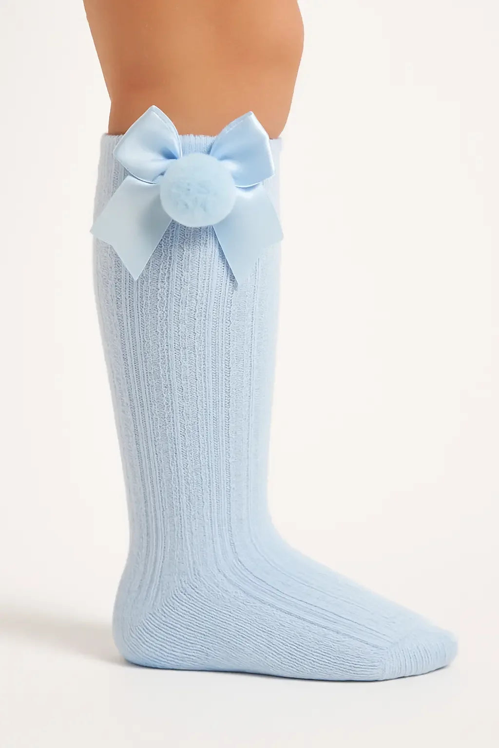 Light blue ribbed baby knee-high sock with satin bow and pom pom detail
