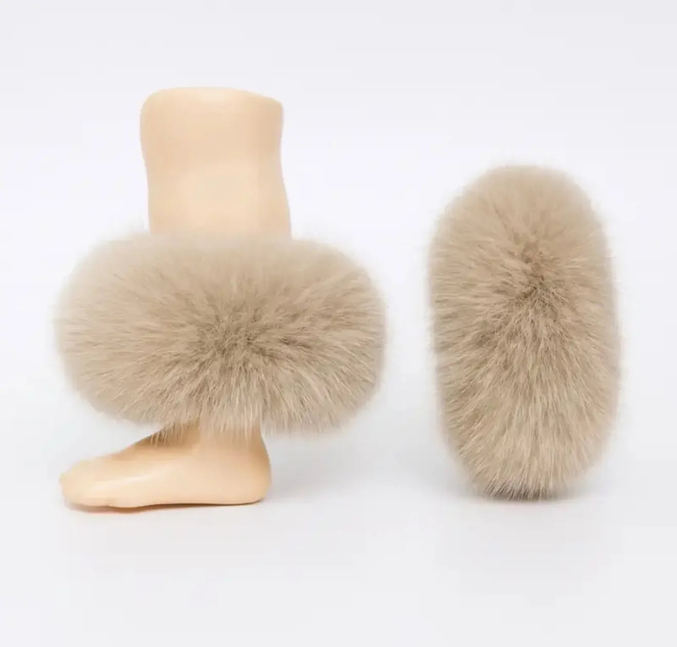 Beige fur leg warmers displayed on mannequin leg and separately on white background