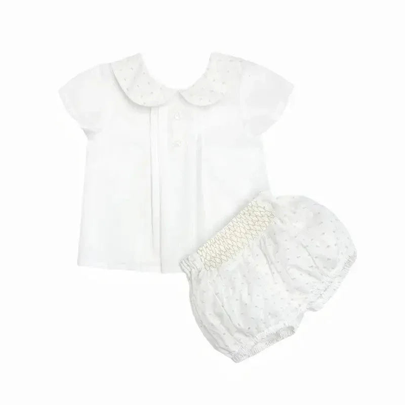 White baby boys shirt with Peter Pan collar and matching white plumeti shorts with smocked waist