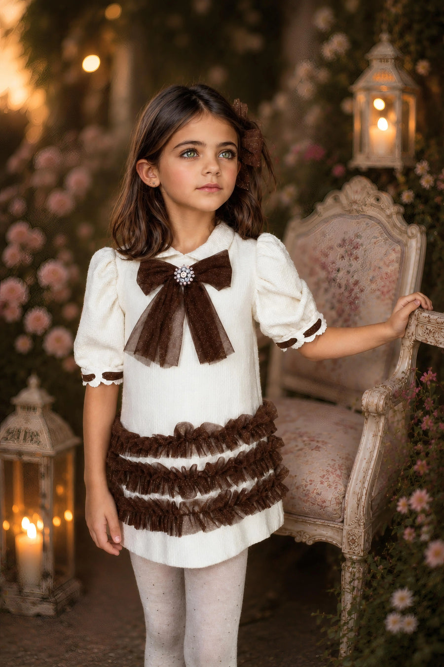 AW26 Naxos Chocolate Glitter Tulle A Line Dress in brown with bow detail, layered skirt. Available in sizes 3-12 years.