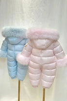 Two puffer winter snowsuits for toddlers with fur trimmed hoods and sleeves in light pink and light blue