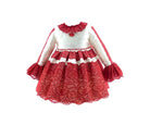 Red and white girls dress with lace detailing, ruffled cuffs, and collar against white background