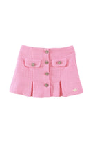 Pink tweed girls skirt with decorative crystal buttons and front pockets on white background