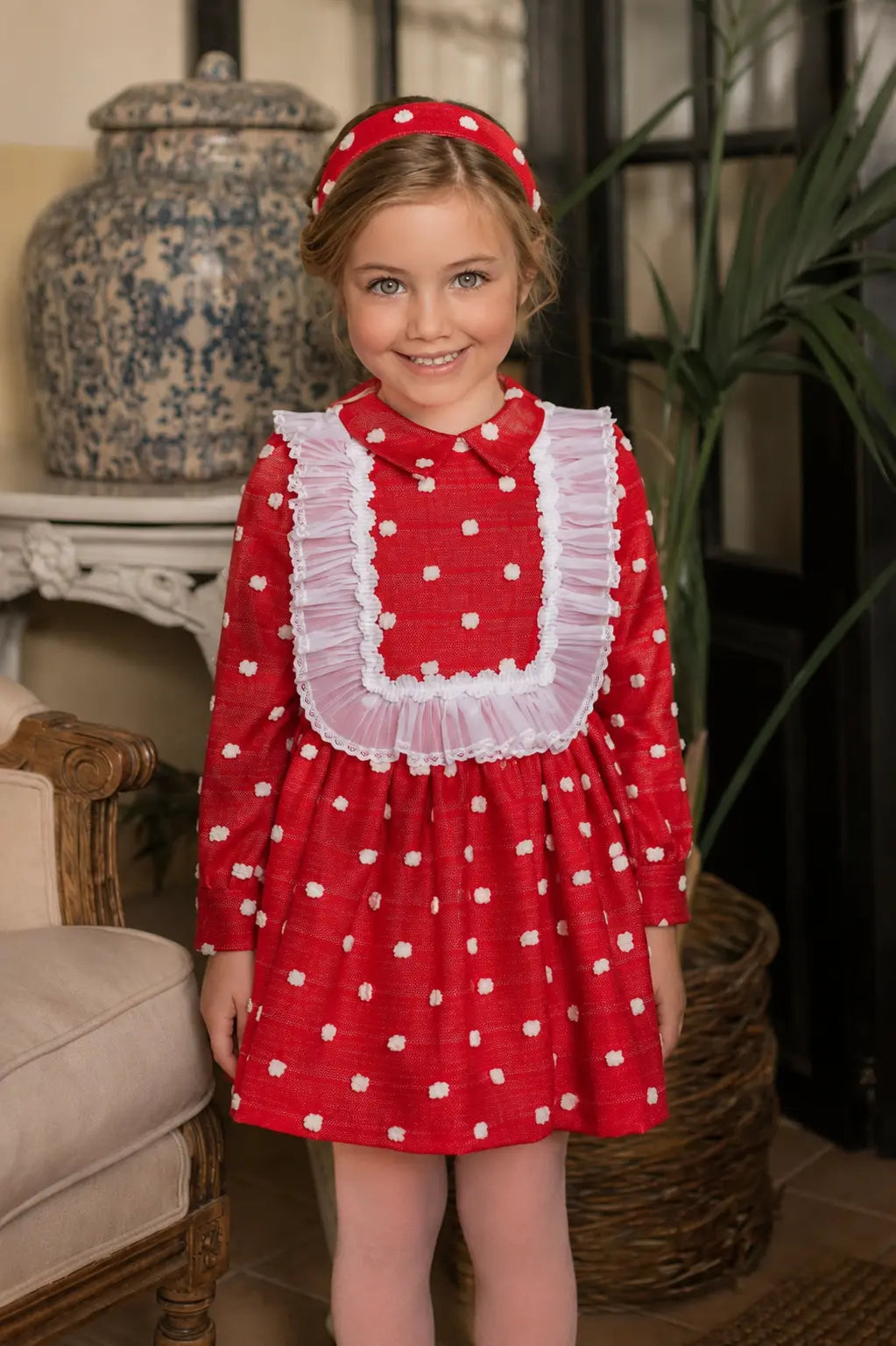 AW26 Rochy girls red dress with 3D white spot detailing, sheer ruffle bib and full gathered skirt, sizes 4 to 14 years