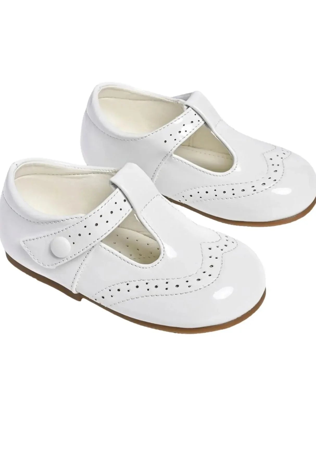 White patent leather baby Mary Jane shoes with perforated detailing and brown soles