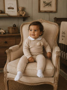 AW26 Baby Boy Beige Knitted Tracksuit with Pom Pom Detail Dainty Delilah