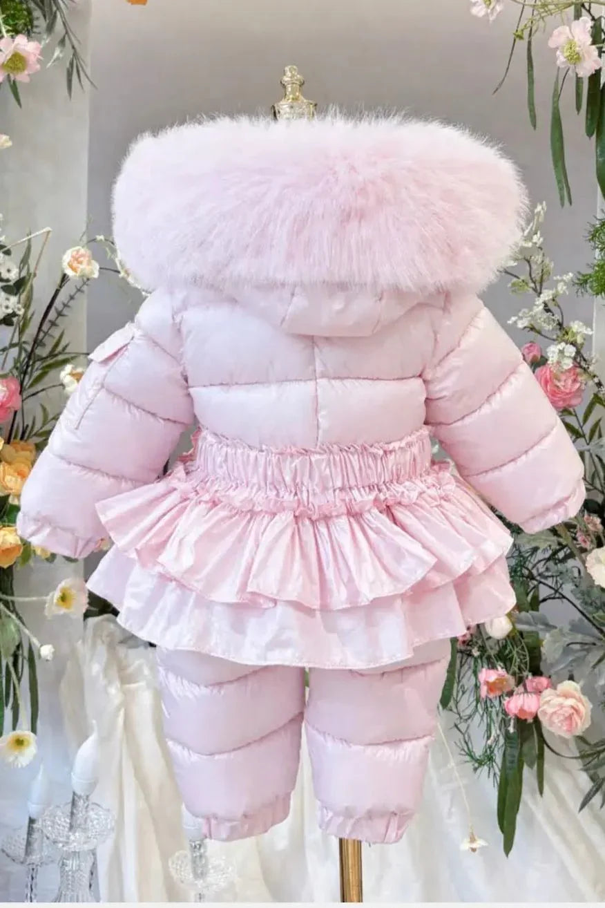 Back view of pink toddler puffer jacket with fluffy fur collar and ruffled skirt detail