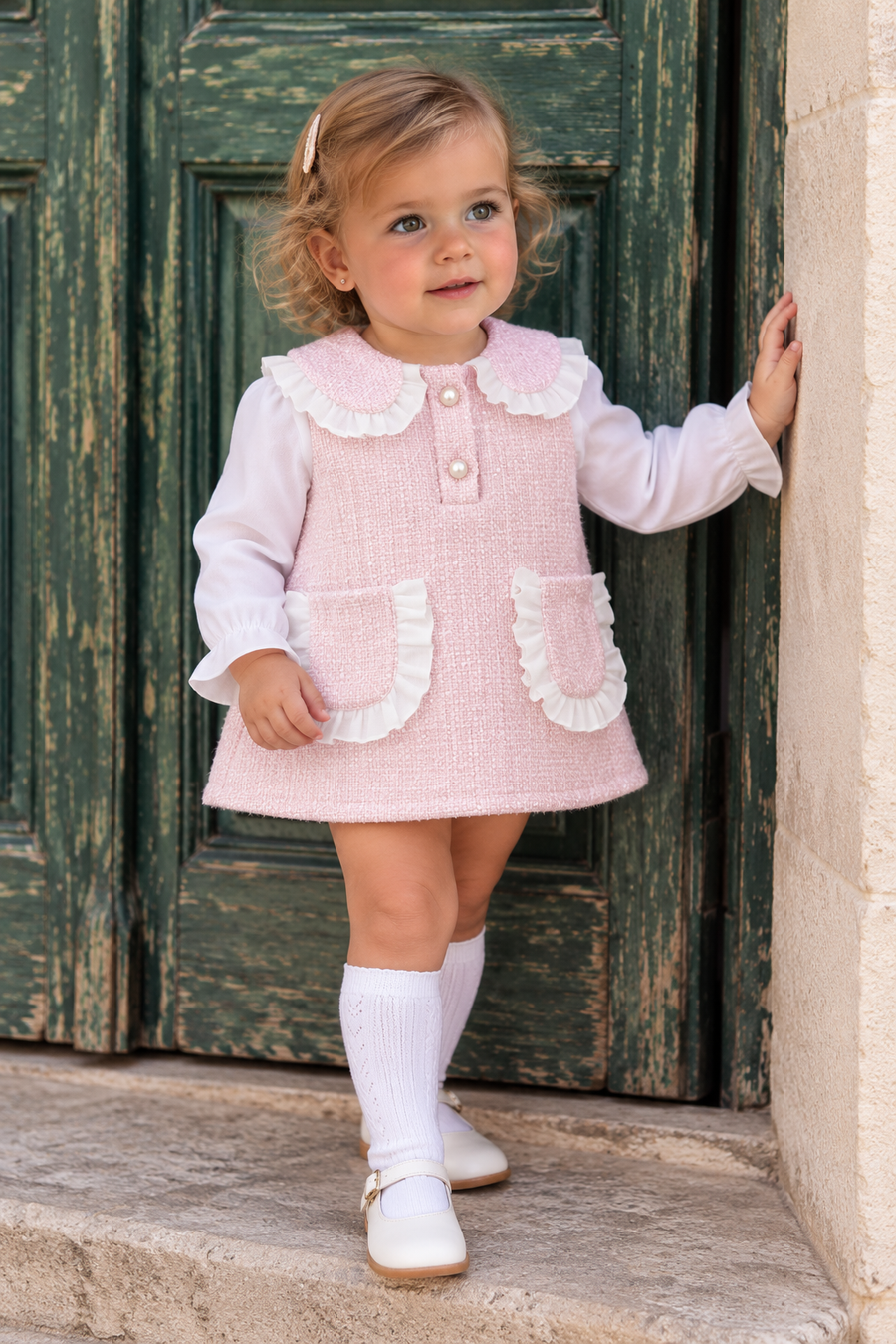 AW26 Lor Miral Baby Girls Pink Tweed Dress with white collar and ruffled pockets, available in sizes 3, 6, 12, 18, and 24 months.