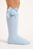 Light blue ribbed baby knee-high sock with satin bow and pom pom detail