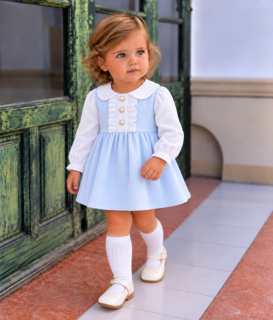 AW26 Lor Miral Baby Girls Blue Spanish Pique Classic Dress with white collar and button details, available in sizes 3-24 months.