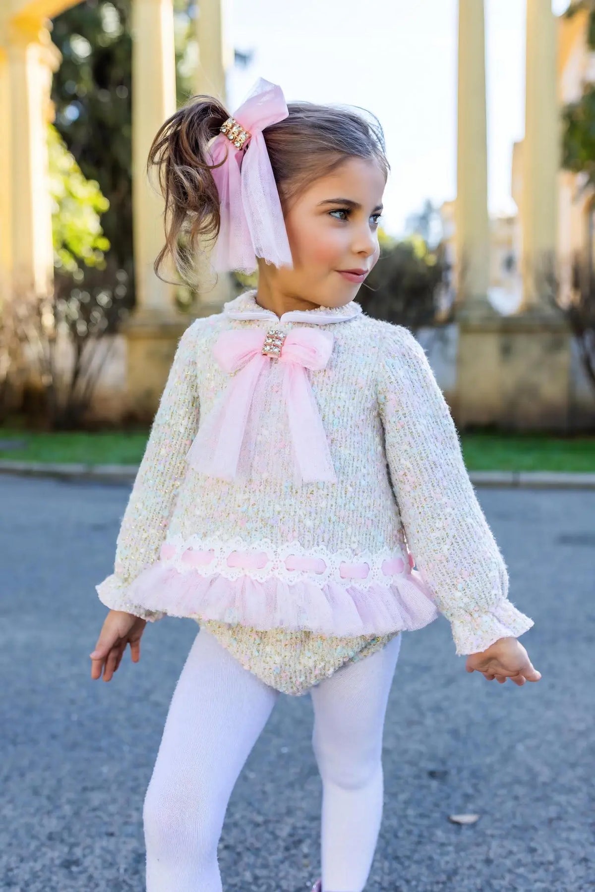 AW26 Naxos Pink Tweed Tulle Baby Dress & Knickers with light pink tulle overlay, large bow, available in sizes 3M to 6Y.