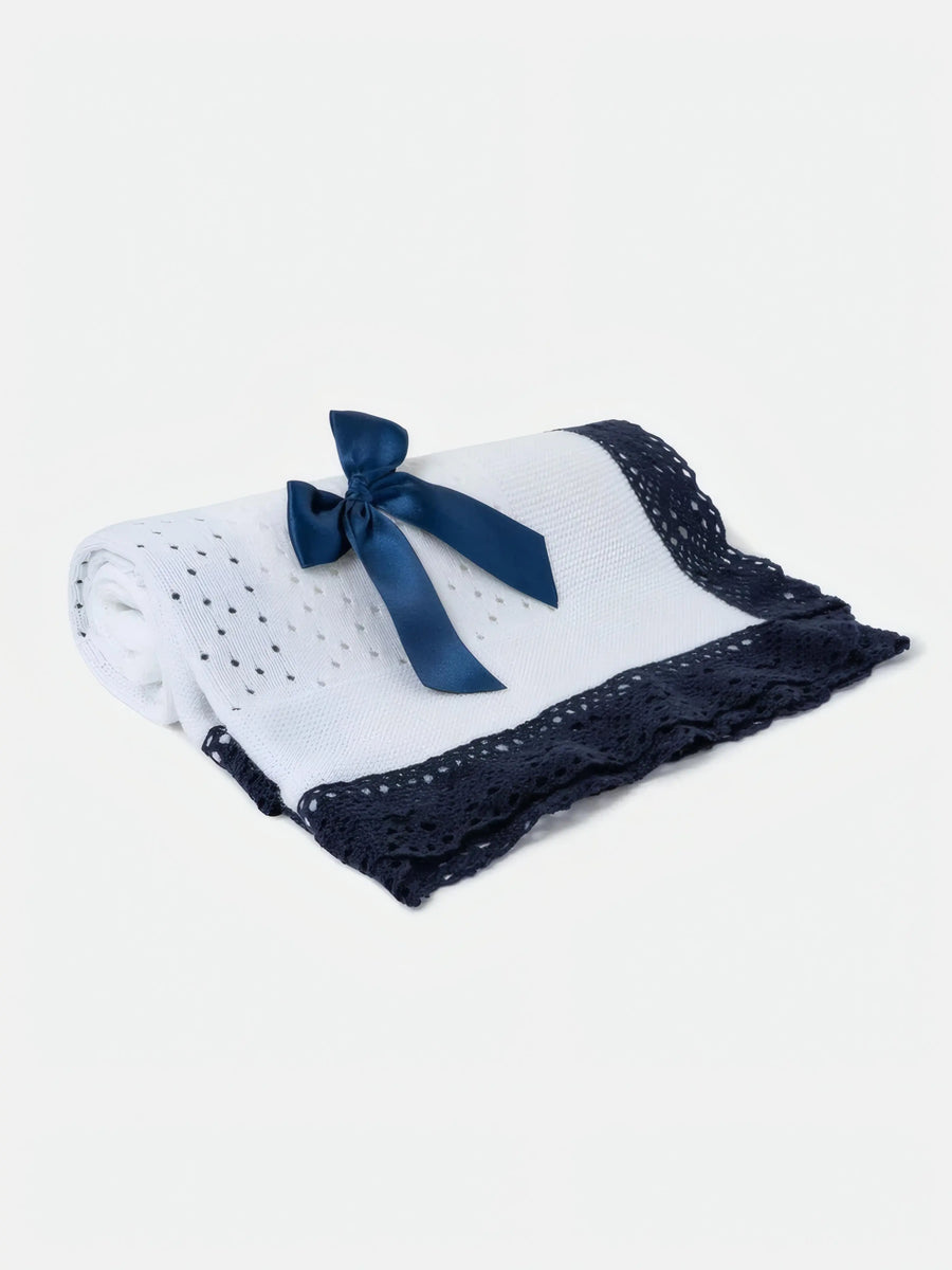 AW26 Baby Open Dot Knitted Spanish Blanket with Bow in white and navy blue, featuring crochet lace edging and a satin bow. One size available.