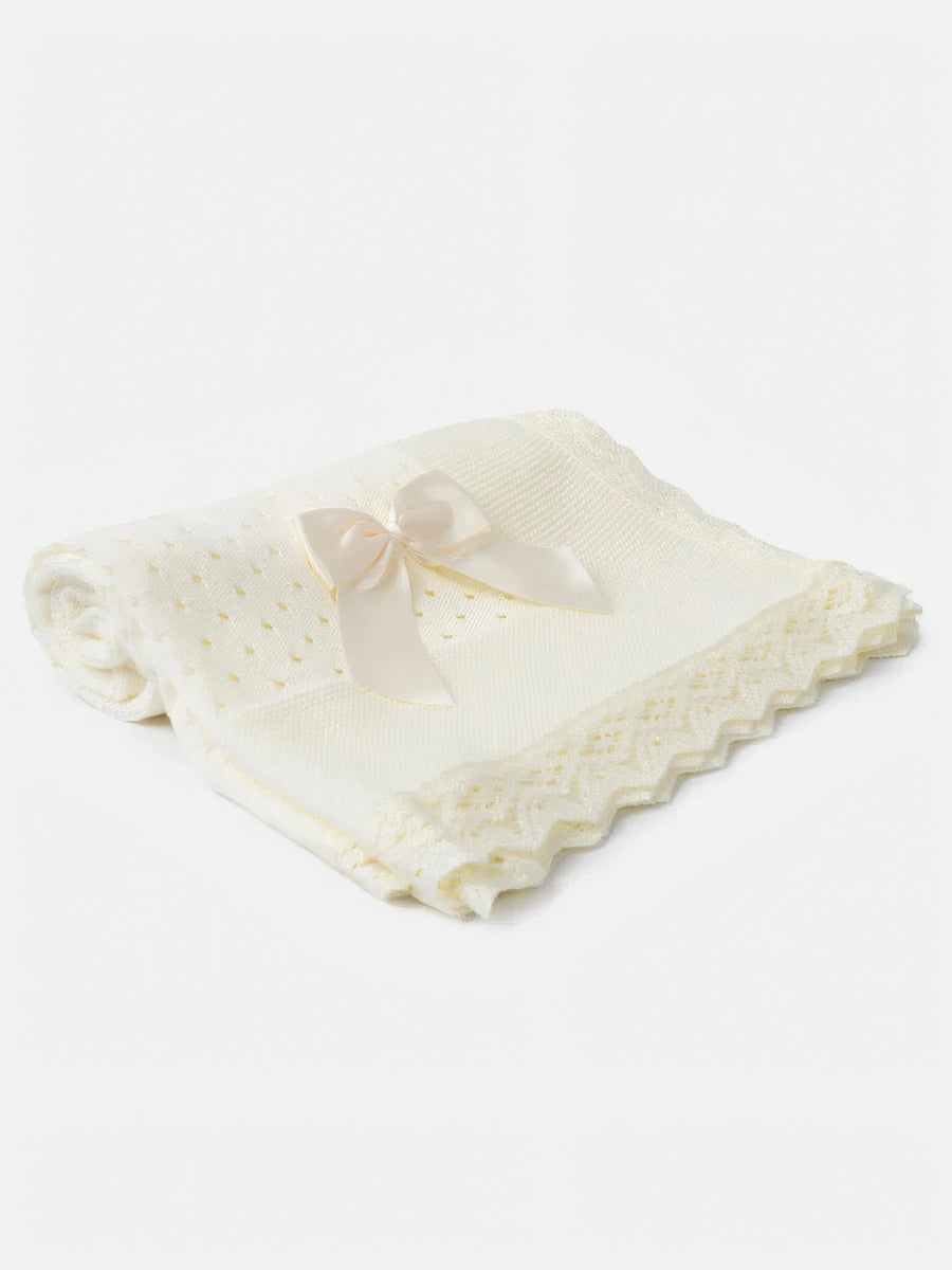 AW26 Baby Open Dot Knitted Spanish Blanket with Bow in ivory, featuring crochet lace edging and satin bow. One size available.