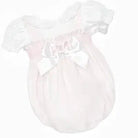 Dainty pink Spanish baby romper with puff sleeves and large satin bow on front