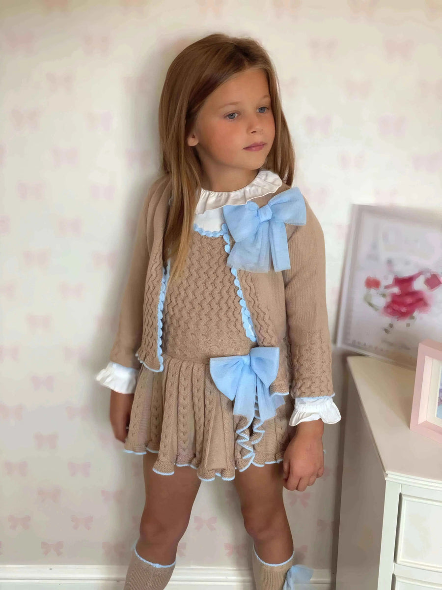 AW26 Rahigo EXCLUSIVE Camel & Blue Pinafore with Cardigan, Bow & Socks - Available in Sizes: 12 Months, 18 Months, 2 Years, 3 Years, 4 Years, 5 Years, 6 Years.
